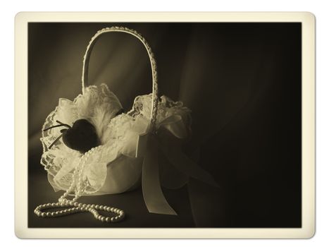 Old photo of bridal flower basket with pearl neklace