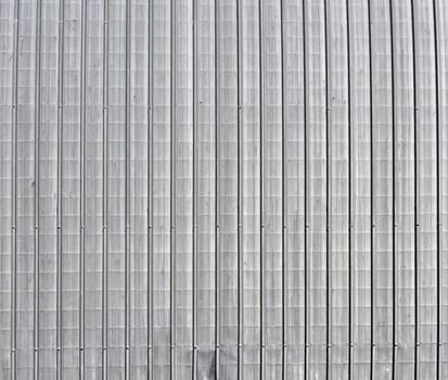 Corrugated steel plate useful as a background