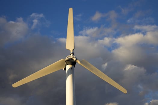 Wind Turbine against cloudy sky