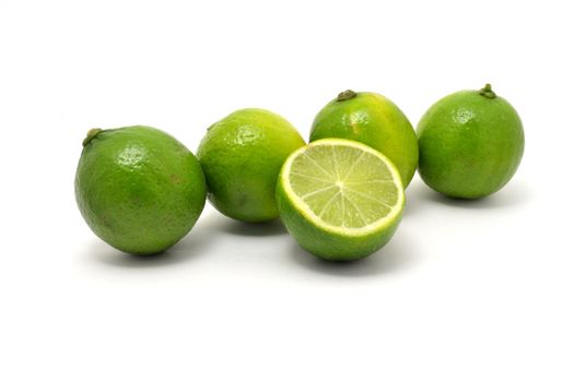 The fresh limes over white background