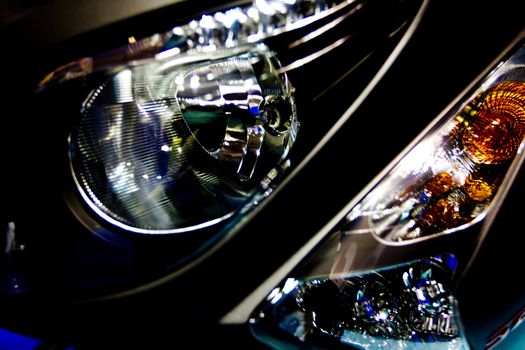 Close-up image of headlamp and turn signal of motorcycle