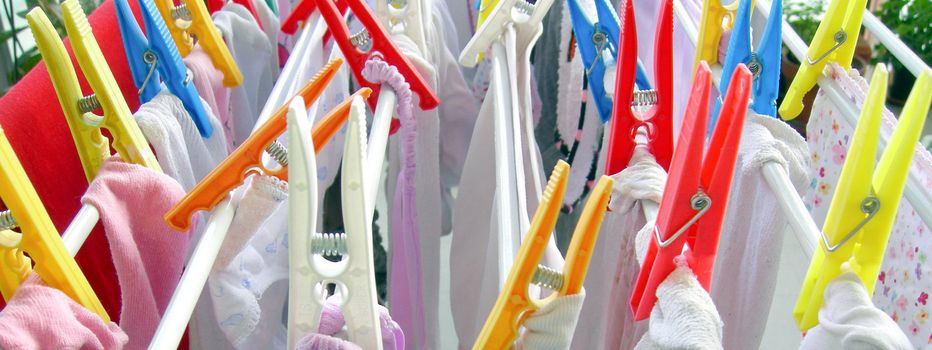 Multi coloured clothespins clothes pegs
