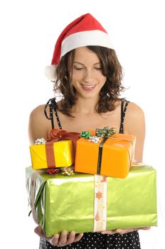 Pretty young woman holding christmas gifts, isolated on white background.