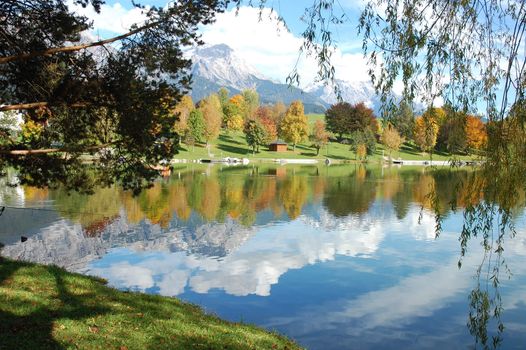 Beautiful reflection of austrian alps in lake called Ritzensee