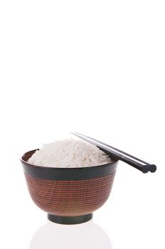 Bowl of cooked rice with chopsticks isolated on white background