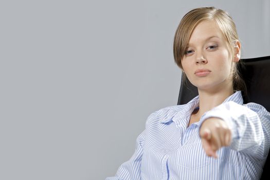 Portrait of businesswoman pointing in office