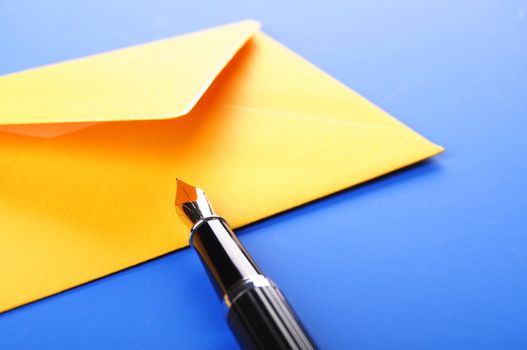 envelop and pen showing mail or communication concept