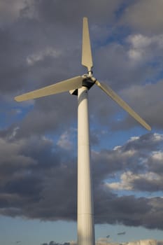Wind Turbine against cloudy sky
