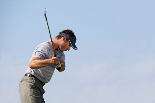 Young man playing golf