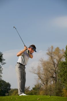 Young man playing golf