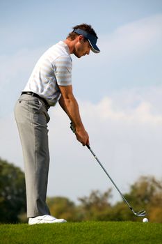 Young man playing golf