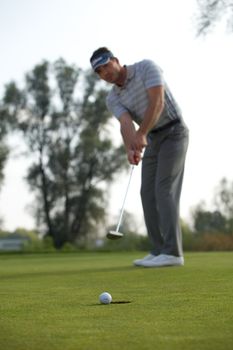 Young man playing golf