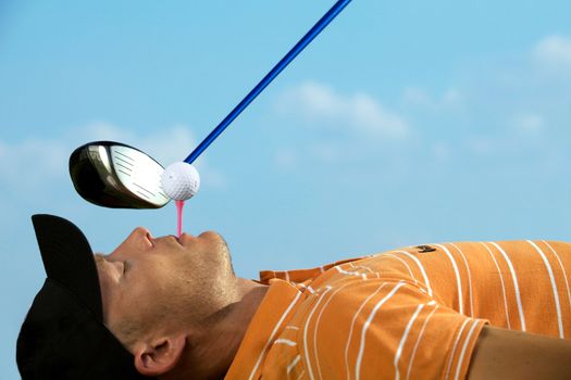 Man balancing golf ball on tee in his mouth
