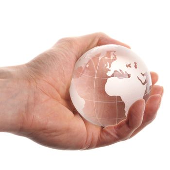 hand holding globe to protect the fragile environment