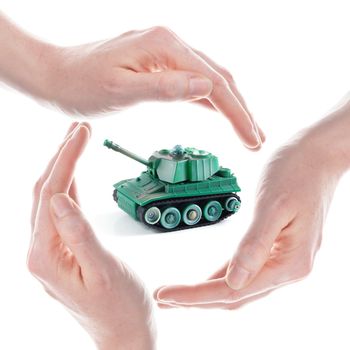 peace concept with toy tank and hand isolated on white background