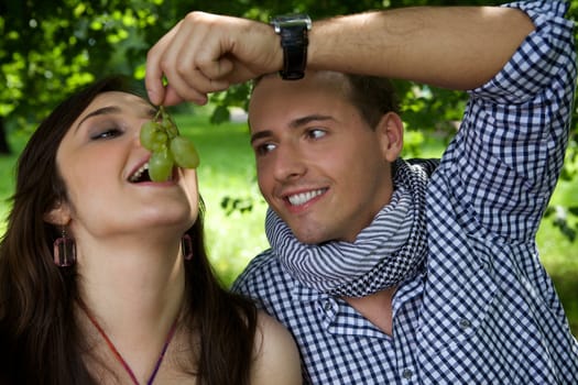 Boyfriend feeding girlfriend