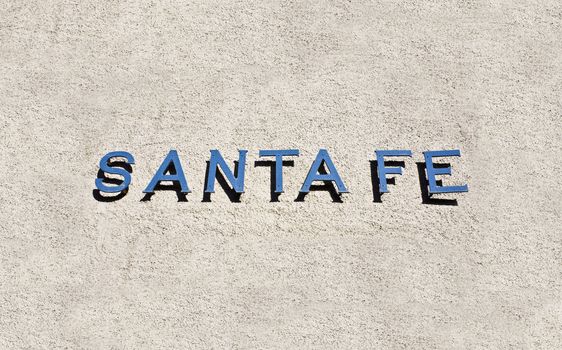 Santa Fe Welcome SIgn on the adobe wall