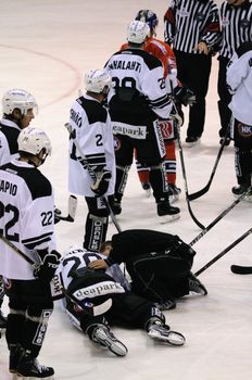 ZELL AM SEE; AUSTRIA - SEPTEMBER 3: Red Bull Salute Tournament. Jens Skalberg of TPS Turku injured.  Game between TPS Turku and Eisbaeren Berlin  (Result 1-4) on September 3, 2010, at the hockey rink of Zell am See