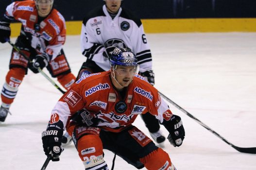 ZELL AM SEE; AUSTRIA - SEPTEMBER 3: Red Bull Salute Tournament. Jens Baxmann of Berlin fighting for the puck. Game between TPS Turku and Eisbaeren Berlin  (Result 1-4) on September 3, 2010, at the hockey rink of Zell am See