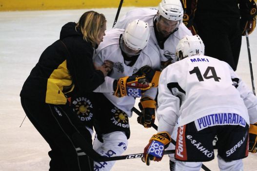 ZELL AM SEE, AUSTRIA - SEPTEMBER 3: Red Bulls Salute Tournament. Petteri Nokelainen injured after hard hit. Game Jokerit Helsinki vs. SC Bern (Result 0-2) on September 3, 2010 in Zell am See