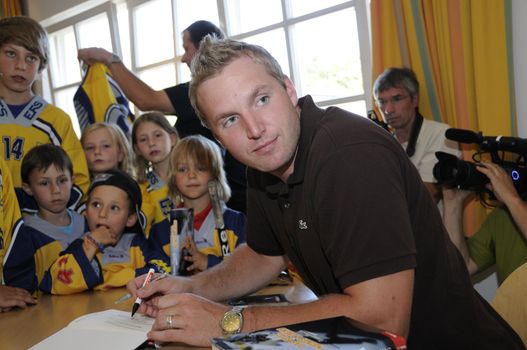 Zell am See, Austria - Jul 8. NHL star player Thomas Vanek visits his hometown Zell am See in Austria on 8th July 2010, to speak to young players of the hockey club Zell am See and giving autographs.