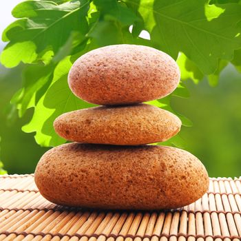 zen stack or tower with green summer leaf showing spa or wellness