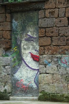 Street Graffiti of a womans head in Sorrento Italy.