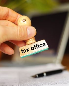 pay your taxes concept with stamp in office and copyspace