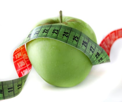 Green Apple isolated on white with measuring tape.