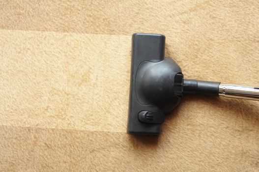vacuum cleaner and copyspace showing housework or domestic life concept