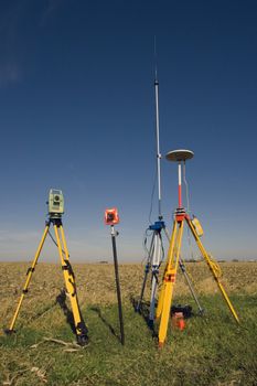 GPS unit, Total station and Prism set in the field.