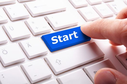 start concept with button or key showing business success concept
