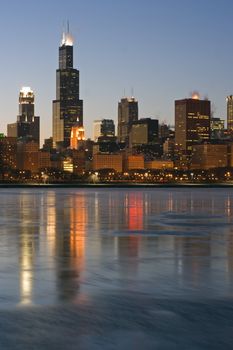 Skyscrapers reflected in icy Lake Michigan - Chicago, Il.