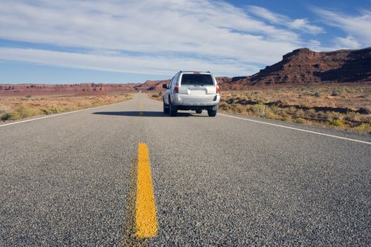 Silver SUV driving in Utah.