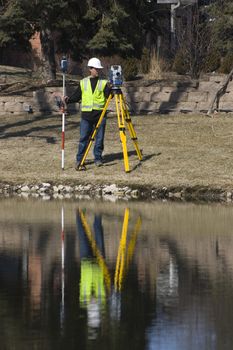 Reflection of a Surveyor working with robotic station