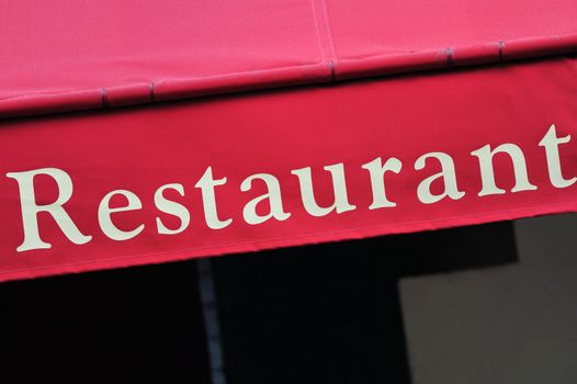 Signboard by entrance in restaurant. Paris. France