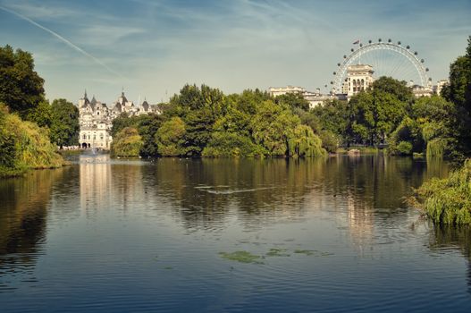 St James Park lake with Horse Guards and London Eye in the background.