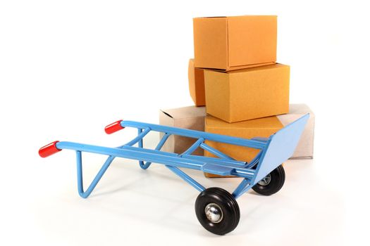 a sack truck and packing boxes on a white background