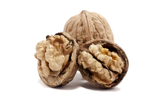 close view detail of  some walnuts  isolated on a white background.