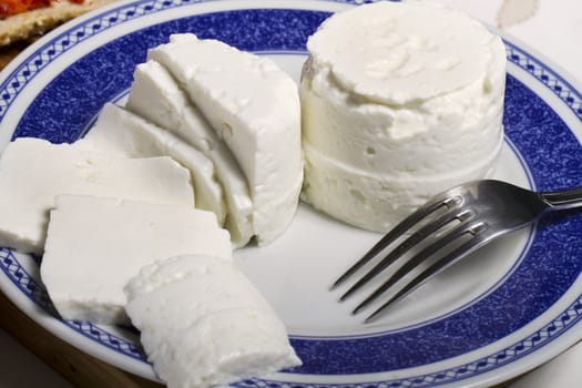View of a dish of fresh cheese on a plate.