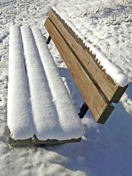park bench with snow