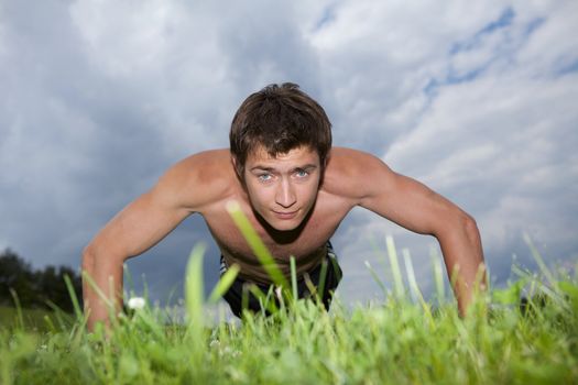 Young man exercising in park