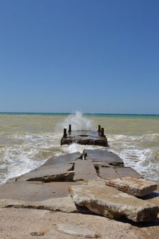 View of the dock and splashing waves