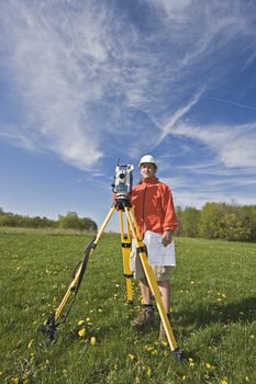 Surveying with theodolite - spring land surveying.