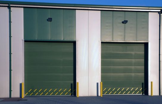 Two large doors of a modern industrial unit