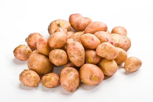 hill of new potatoes over white background