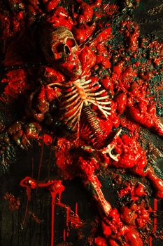 Halloween image / background of blood, bones and guts.  Sculpture was built by me for a haunted house from a plastic skeleton, so I hold any copyrights.

