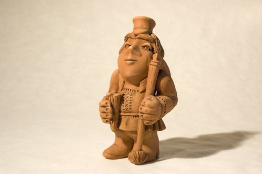 subject is the clay figurine of the peasant