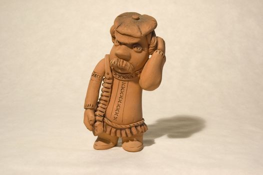 subject is the clay figurine of the peasant