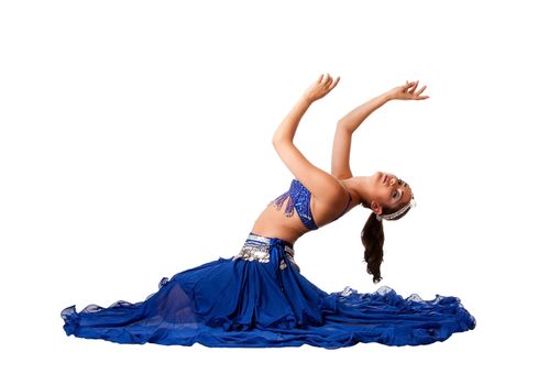 Beautiful Israeli Egyptian Lebanese Middle Eastern belly dancer performer in blue skirt and bra with arms in air sitting and bending backwards, isolated.